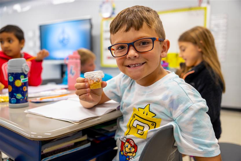 Students smile in science class